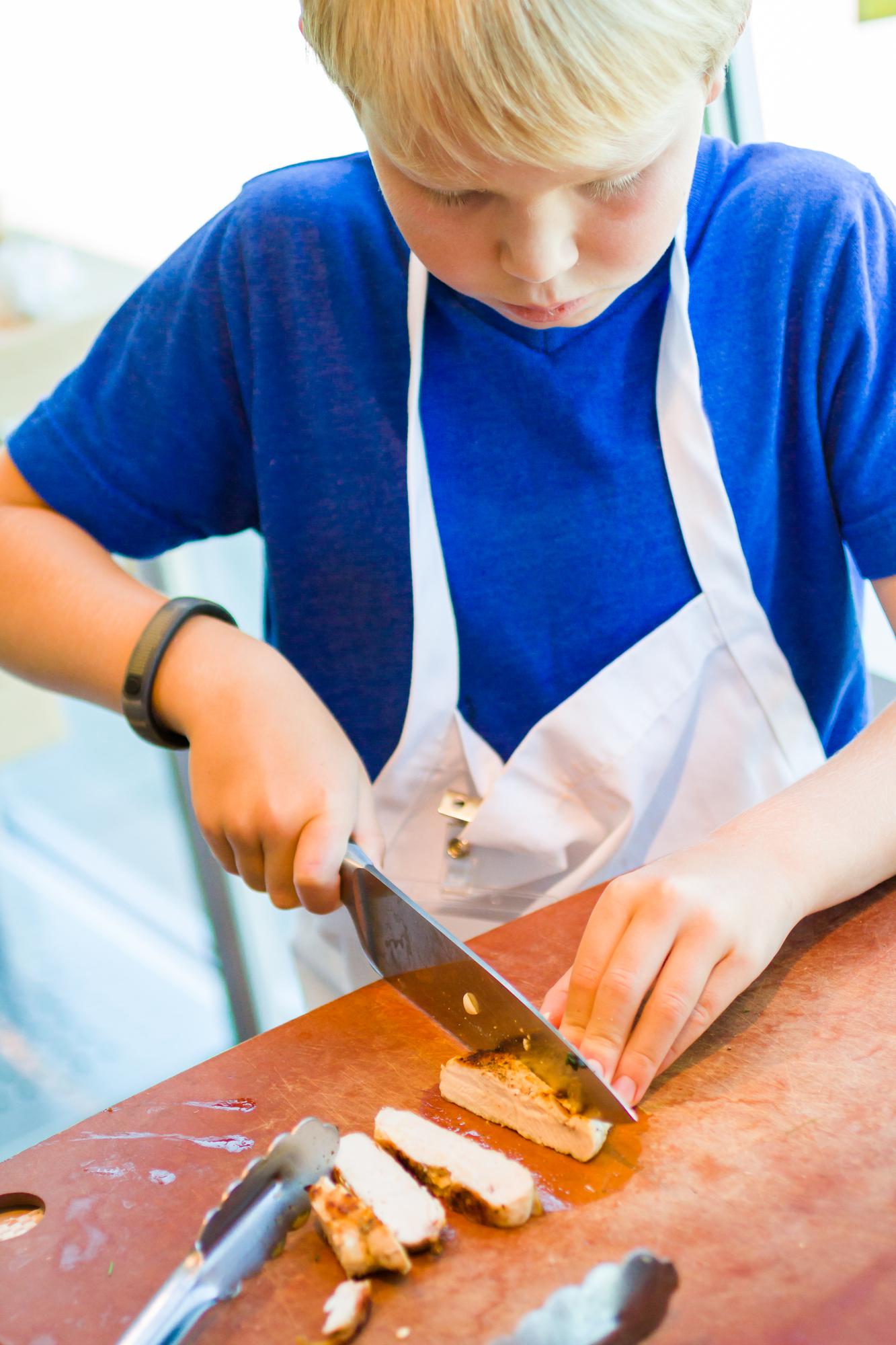 Students learning knife skills